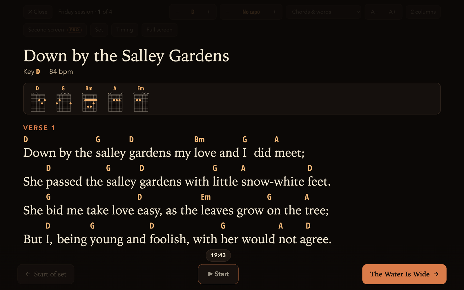 The stage view: a song's words and chords large and clear on a dark screen, with the next song shown at the bottom.
